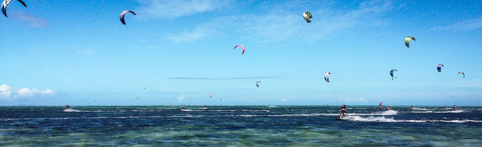 Kite surfers at Ilot Maitre, one of the best beaches in New Caledonia.